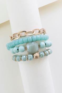 The Brooke Turquoise Beaded Bracelet is a stunning piece that combines the vibrant beauty of turquoise with the elegance of gold accents. This bracelet features aqua crystal and gold chain bracelets, creating a harmonious blend of colors and textures. The turquoise beads exude a sense of tranquility and sophistication, while the gold chain adds a touch of glamour and refinement. Designed for layering, this bracelet can be worn alone or stacked with other bracelets to create a personalized and tr Gold Chain Bracelets, Bracelet Layering, Bracelet Stacks, Turquoise Bead Bracelet, Turquoise Crystal, Chain Bracelets, Gold Bracelet Chain, Layered Bracelets, Strand Bracelet