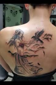 a woman with a tattoo on her back