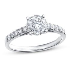 a white gold engagement ring with diamonds on it