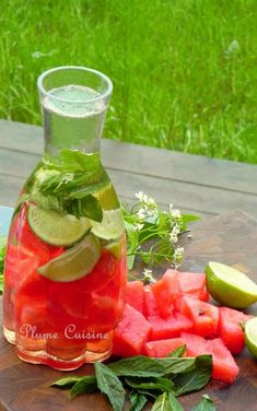 watermelon and lime juice in a pitcher on a cutting board