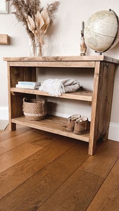 a wooden shelf sitting on top of a hard wood floor