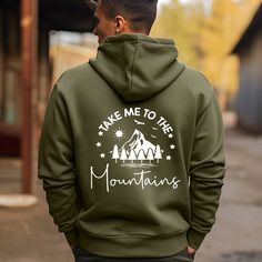 Classic Fit Take Me To The Mountains Hoodie, Vacation Unisex Hoodies, Mountain Hoodie, Camping Camper Gift, Adventure Hoodie, Hiking Hoodie 8 Oz./Yd² (Us) 13.5 Oz./L Yd (CA), 50% Cotton 50% Polyester Heather Sport Colors: 40/60 Cotton/Polyester Safety Green: Compliant With ANSI / ISEA 107 Air Jet Yarn for a Softer Feel and Reduced Pilling Double-lined Hood With Color-Matched Drawcord Double-needle stitching at Shoulders, Armholes, Neck, Waistband, and Cuffs Double-needle pouch Pocket for Added Reinforcement 1 X 1 Rib With Spandex for Enhanced Stretch and Recovery Take Me To The Mountains Hoodie Grey Pearlized Tear-Away Label Take Me To The Mountains Hoodie, Vacation Unisex Hoodies, Mountain Hoodie, Camping Camper Gift, Adventure Hoodie, Hiking Hoodie. High-quality Air Jet Yarn for a Softer Hiking Hoodie, Camping Camper, Gifts For Campers, Grey Hoodie, Hoodie Design, Halloween Tshirts, The Mountain, Pocket Pouch, Cool Shirts