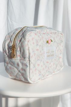 Exclusive castle pattern cosmetic bag. It is quilted and lined with a “made of magic” pink print, and features a heart zipper pull. Can be used a travel bag, makeup bag, tech bag, skincare bag, and so much more.Size: 8” x 6” x 4”100% Nylon *Final sale / not eligible for discounts Cute Cosmetic Zipper Pouch For Storage, Cute Cosmetic Bag With Zipper For Storage, Cute Travel Pouch With Zipper Closure, Cute Cosmetic Bag With Zipper Closure For Personal Use, Quilted Pouch Cosmetic Bag Gift, Quilted Cosmetic Pouch Bag As Gift, Quilted Pouch Cosmetic Bag As Gift, Quilted Pouch Cosmetic Bag, Skincare Bag