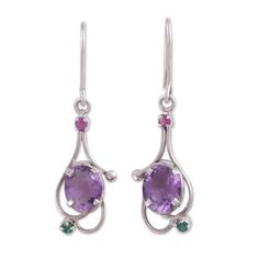 Totaling over six carats a two glistening ovals of purple amethyst are accompanied by petite ruby and emerald stones in this alluring pair of dangle earrings from India. Alok Jain presents the earrings which are crafted of sterling silver by local artisans. Oval Amethyst Earrings With Gemstone Accents, Elegant Gemstones With Gemstone Accents For May Birthstone, Elegant Gemstones With May Birthstone Accents, Elegant May Birthstone Gemstones With Accents, Purple Oval Earrings With Gemstone Accents, Elegant Purple Birthstone Gemstones, Green Amethyst Oval Jewelry, Green Oval Amethyst Jewelry, Moonstone Pendant Necklace