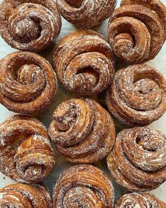 several pastries are arranged on a baking sheet