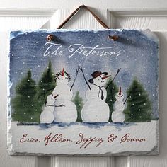 two snowmen are holding ski poles in front of a sign that says the reflections