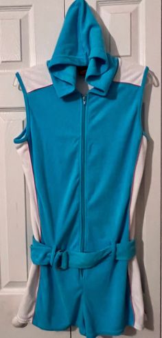 vintage mod retro junior women's aqua terrycloth belted shorts jumpsuit. size L . excellent preowned vintage condition and freshly laundered. from a smoke and pet free home Fitted Blue Dresses With Side Pockets, Cotton Fitted Jumpsuits And Rompers With Pockets, Fitted Cotton Jumpsuits And Rompers With Pockets, Spring Trendy Fitted Jumpsuits And Rompers, Trendy Fitted Jumpsuits And Rompers For Spring, Fitted Sleeveless Cotton Jumpsuits And Rompers, Fitted Sleeveless Cotton Jumpsuit, Blue Fitted Cotton Jumpsuits And Rompers, Fitted Blue Cotton Jumpsuits And Rompers