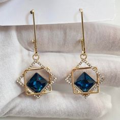 Elevate your look with these stunning CZ Blue Crystal Dangle Drop Earrings. The radiant blue crystals add a touch of glamour to any outfit. Perfect for any occasion, these earrings are sure to make you stand out and feel confident. Add a pop of color to your wardrobe today! Material: Brass/Sterling Silver Needle Earrings Size: 2.1"x0.9" Sapphire Crystal Dangle Earrings For Formal Occasions, Sapphire Crystal Dangle Earrings For Formal Events, Sapphire Dangle Crystal Earrings For Formal Occasions, Formal Blue Crystal Earrings, Elegant Sapphire Crystal Dangle Earrings, Blue Dangle Crystal Earrings For Formal Occasions, Sapphire Crystal Dangle Earrings For Party, Sapphire Dangle Crystal Earrings For Party, Blue Crystal Drop Earrings