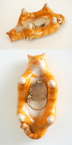 an orange and white cat shaped object with two rings on it's back end