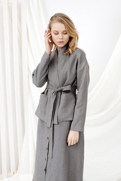 Linen Wrap Cardigan, Linen Loungewear, Kimono CardiganD E S C R I P T I O N- Loose fit- Dropdown shoulders- Kimono collar- Long sleeves- Two large front pockets- Short length- Belt D E T A I L S- Name: BERLIN• Sizes: XS - XXL• 100% European soft and washed linen fabric (weight 206 g/m² | 6.49 oz/yd²). Fabric is woven according to universally accepted quality requirements, which correspond to OEKO-TEX® Standard 100 certified.• Model (5'7" | 172cm ) wearing Grey in size S. Please choose another co Spring Workwear Cardigan With Shawl Collar, Spring Workwear Shawl Collar Cardigan, Gray Long Sleeve Cardigan For Work, Spring Shawl Collar Cardigan For Work, Spring Cardigan With Pockets And Stand Collar, Gray Blazer With Stand Collar For Work, Casual Long Sleeve Kimono For Work, Elegant Cardigan With Pockets For Daywear, Gray Open Front Outerwear With Pockets