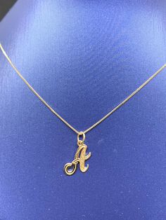 14k Solid gold cursive initial pendant  With or without chain  Choice of chain length These pendants are made with solid 14k gold. The pendants are diamond cut design with solid loop marked 14k. The pendant is approximately 12mm tall.  Can be ordered with or without 14k solid gold box chain. The Box chains are known for their strength and beauty. Both the charms and chains are marked 14k for metal authenticity. Can be worn itself or layer it with other necklaces. Comes in a beautiful gift box. Letter Necklace Gold, Gold Necklace With Name Initial Pendant, Necklace For Your Girlfriend, Letter A Necklace, Gold Chain Necklace With Initial Pendant, Gold Initial Pendant Chain Jewelry, Gold Initial Necklace, Gold-tone Initial Pendant Charm Necklace With Chain, Gold-tone Chain Necklace With Initial Pendant For Gift