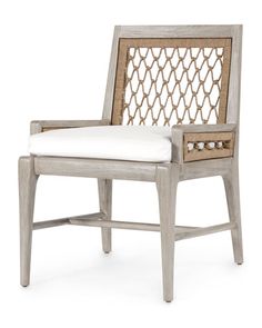 the arm chair is made out of wood and has a white cushion