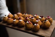 some food that is sitting on a wooden table and ready to be eaten by someone