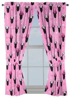 a window with pink curtains and mickey mouse heads on it, in front of a window