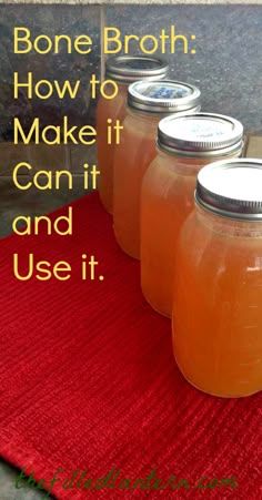 three jars filled with liquid sitting on top of a table