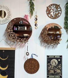 there are several wooden clocks hanging on the wall