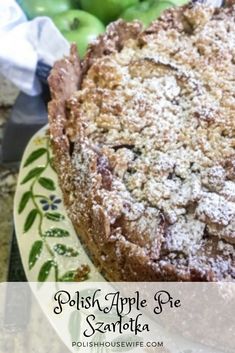 a close up of a cake on a plate with apples in the background and text overlay that reads polish apple pie santa fe