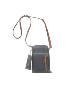 This little cutie really packs an organizational punch! In super soft vegan leather...Meet The Jane crossbody! She comes in the perfect blend of brown and black to ensure her neutral palette will match it all. Measuring 7" x 5" x 2" with a generous 50" detachable cross body strap she has TONS of space! One zipper compartment on the very front of the bag to hold whatever essential item you need to grab most often. Two more oversized gusseted zippered compartments are here too. The back zippered c Brown Phone Bag With Zipper Closure For On-the-go, Brown Satchel Phone Bag For Everyday Use, Brown Crossbody Phone Bag For Everyday, Brown Everyday Crossbody Phone Bag, Functional Brown Shoulder Phone Bag, Functional Brown Phone Shoulder Bag, Versatile Satchel Phone Bag With Cell Phone Pocket, Versatile Phone Bag Satchel With Cell Phone Pocket, Functional Brown Phone Bag For Everyday Use