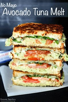 two sandwiches stacked on top of each other with the words, no mayo avocado tuna melt