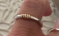 This beautiful mixed metal textured band is made from 14k gold or sterling silver ring is a unique design with its multi coloured metal detail. This simple ring is a super shiny and eye catching piece to add to your minimalist jewelry. This stackable boho style band looks beautiful by itself or layered with your other rings. This gorgeous ring makes a beautiful gift for her or him as a bridesmaid gift or even a wedding band. Please feel free to contact me regarding customizing this bracelet or a Etsy Rings, Bridesmaid Presents, Silversmithing Jewelry, Mixed Metal Rings, Hammered Ring, Gorgeous Ring, Stackable Bands, Hammered Rings, Simple Ring