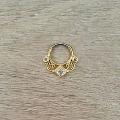 This daith clicker piercing is made of high quality surgical steel in a beautiful gold lace design. Daith earring "clicks" into place. Super dainty minimalist look - drop jaws with this daith jewelry - Listing is for a single item  Details & Size: - 316L Surgical Steel - 16G - Gold or Rose Gold Color Options - Inner diameter: 10mm wide, 9.5mm high  - Whole piece size: 19.7mm wide, 18.3mm high - Every purchase comes with an Elara gift box For sanitary purposes, piercing items are non-returnable, so please double check sizing and message me if you have any questions! 16G Gold Sunburst Daith Jewelry | Cute Daith Earring Clicker | Daith Piercing | Cute Unique Daith Jewelry Dainty Gold Daith Earrings Gift Internally Threaded Hoop Belly Rings, Gift Metal Septum Ring Internally Threaded, Hypoallergenic Gold Surgical Steel Jewelry, Gold Metal Pierced Septum Ring, Hypoallergenic Metal Septum Ring As Gift, Daith Clicker, Daith Earring, Daith Jewelry, Gold Sunburst