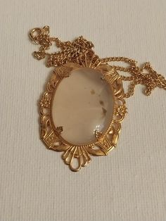 "Beautiful oval shaped cabochon pendant with a pale blue see thru color. Decorative gold tone filigree setting. Pendant is 2x1.15\" on a gold tone 17\" chain. Excellent condition, never worn.  Smoke free home." Luxury Cabochon Necklace For Women, Luxury Rose Gold Oval Cabochon Jewelry, Luxury Engraved Oval Cabochon Jewelry, Cabochon Pendant, Oval Cabochon, Pale Blue, Minneapolis, Pendant Necklaces, Locket