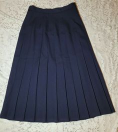 Vintage Corbin LTD Pleated %100 Wool Skirt. Supper cute navy blue side button down pleated skirt. In great condition no tears stains or holes. Great with a pair of leather boots and a nice sweater. SMOKE FREE AND SUPER CLEAN HOME.  Feel free to contact me with any questions. Thank you. Navy Skirt For School In Spring, Classic Blue Pleated Skirt For Spring, Classic Blue Denim Skirt, Navy Fitted Skirt For School, Classic Blue Pleated Bottoms, Fitted Navy Pleated Skirt With Lining, Classic Navy Lined Skirt, Navy Fitted Lined Pleated Skirt, Fitted Navy Pleated Lined Skirt