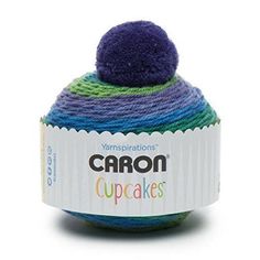 a ball of yarn sitting on top of a white box with the words carbon cupcakes