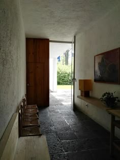 an empty hallway leading to the front door