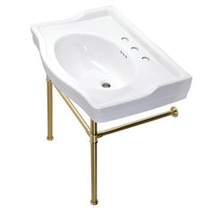 a white sink sitting on top of a gold metal stand next to a white wall