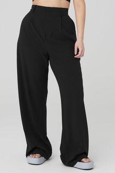 Your wildest trouser dreams just came true. The High-Waist Dreamscape Trouser takes the iconic pleats and silhouette of trousers and takes the look to the next level with lightweight crinkle woven fabric that breathes, moves and sets trends wherever it goes. Layer over a bodysuit or pair with the matching Dreamscape Button Down Long Sleeve! Trouser with lightweight crinkle fabric High waisted with wide leg silhouette Side pockets & faux back welt pockets Designed & uniquely fit to flatter every size Wear-tested by our in-house team for the perfect fit Black Wide-leg Pants For Yoga, Black Compressive Yoga Pants With Wide Waistband, Black Breathable Full-length Pants, Black Wide-leg Yoga Bottoms, Tailored Black Full-length Bottoms, Woman Back, Alo Yoga, Back Women, Workout Wear