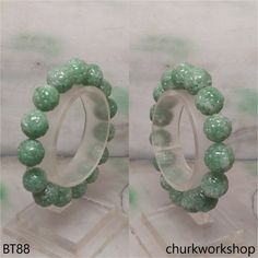 Green carved jade beads bracelet 7 inches •Cut: Carved bead•Color: Green•Size: 11.5 - 12.5 mm •Weight: 39.9 grams•Translucency: Opaque•Code: BT88 Symbolizes: Good luck, protection, longevity*****Note: These beads were handmade, size are slightly different.*****This hand crafted jade pendant is guaranteed to be 100% natural, non-enhanced, and untreated. We do our best to keep the photos the same as the item; these photos are not enhanced or edited. Please keep in mind that the color may vary on different monitors. •Should you find that this piece does not meet your expectations, we do accept returns within 7 days of receiving the product. However you must notify us within 24 hours of receiving the item. For more details on our Payment and/or Return policy, please visit the following link: h Carved Jade, Jade Bangle, Jade Ring, Jade Bracelet, Jade Carving, Jade Stone, Jade Beads, Jade Pendant, Beads Bracelet