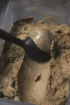 a scoop of ice cream in a plastic container