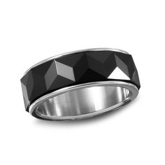 a black diamond wedding ring with an octagonal design in white gold, on a white background