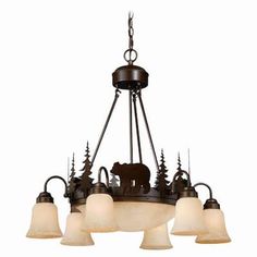 a chandelier with five lights hanging from it's center and bear silhouettes on the bottom