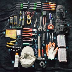 an assortment of tools laid out on top of a black cloth with the words electric arts and science written below it