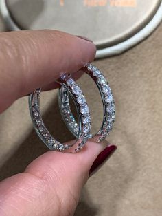 These diamond hoop earrings have been given a stylish touch with elegant round cut diamonds placed inside and out. 18Kt white gold hoop earrings are set with 2.48carats in round diamonds. Every woman can always use a pair of classic diamond hoop earrings to add to their wardrobe. Accessorize with these hoop earrings for fun and casual looks, or formal occasions where you want focus to be on your outfit.Metal: 18KT White GoldDiamond Weight: 2.48ct t.w.Diamond Shape: 38 RoundEarring Width: 3 mmEar