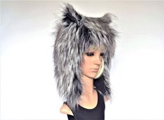 a mannequin head wearing a furry hat