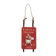 a red christmas ornament with a reindeer on it