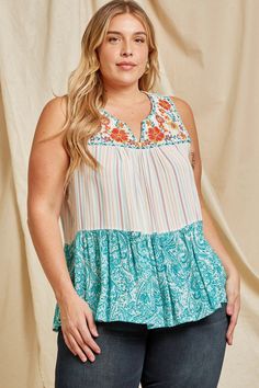 We love the boho vibe of this gorgeous embroidered mix media blouse. It features a split V-neckline, has colorful embroidery on the yoke, is sleeveless & and has a relaxed a-line tiered flowy silhouette. Pair this up with skinny jeans and sandals for a chic look! Small Bust 38" L 27" : Medium Bust 40" L 27" : Large Bust 42" L 27" 1X Bust 50" L 28" : 2X B 52" L 28" : 3X Bust 54" L 28" 100% Woven Rayon - no stretch Hand wash cold Bohemian Multicolor Embroidered V-neck Top, Flowy Bohemian Embroidered Summer Top, Bohemian Flowy Embroidered Summer Top, Flowy Bohemian Embroidered Top For Summer, Multicolor Sleeveless Embroidered Top For Spring, Casual Multicolor Sleeveless Embroidered Top, Bohemian Sleeveless Top With Floral Embroidery, Multicolor Bohemian V-neck Embroidered Top, Bohemian Sleeveless Embroidered Top For Beach