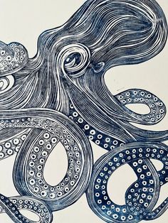 an ink drawing of an octopus in blue and white with swirls on it's tentacles