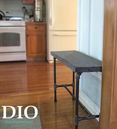 a kitchen with a table and stove in it