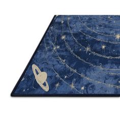 a blue rug with an image of saturn and the moon on it's surface