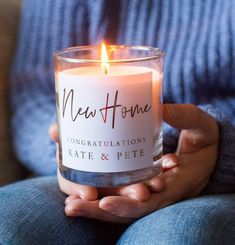 a person holding a candle in their hands with the words congratulations kate and pete written on it