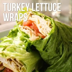 there is a wrap with lettuce and tomatoes on it that says turkey lettuce wraps