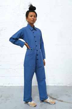 Get ready to enter a bullshit-free zone. This boiler suit is made for movement and comfort, with darts at the back for a feminine touch. Contrast colors at undercollar and sleeve cuff. The style features a wide pant leg and a shorter inseam, so if you’re taller than 5’8”, you get to show off your sexy ankles (or kooky socks or Doc Martens or whatever). 100% cottonMade in China by Uncle Pun Fits true to size. We recommend choosing according to your pant size. If you have a longer torso, please si Blue Cotton Long Sleeve Denim Jumpsuit, Blue Cotton Denim Jumpsuit With Long Sleeves, Blue Long Sleeve Cotton Denim Jumpsuit, Blue Relaxed Fit Overalls, Blue Overall Jumpsuit For Work, Blue Long Sleeve Overalls For Spring, Blue Long Sleeve Relaxed Fit Denim Jumpsuit, Blue Denim Jumpsuit With Relaxed Fit And Long Sleeves, Long Sleeve Blue Cotton Overalls