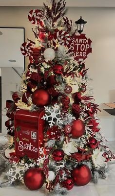 a christmas tree decorated with red and white ornaments