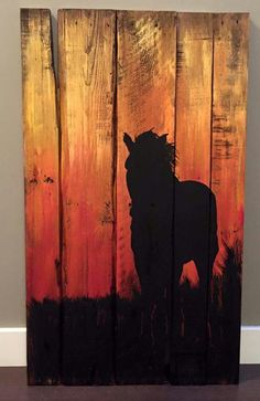 a painting of a horse on wood with orange and black colors in the back ground