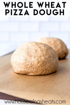 two whole wheat pizza doughs sitting on top of a cutting board with the words, how to make whole wheat pizza dough