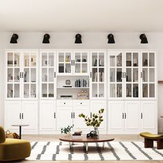 a living room filled with furniture and lots of white cupboards next to a black and white checkered rug